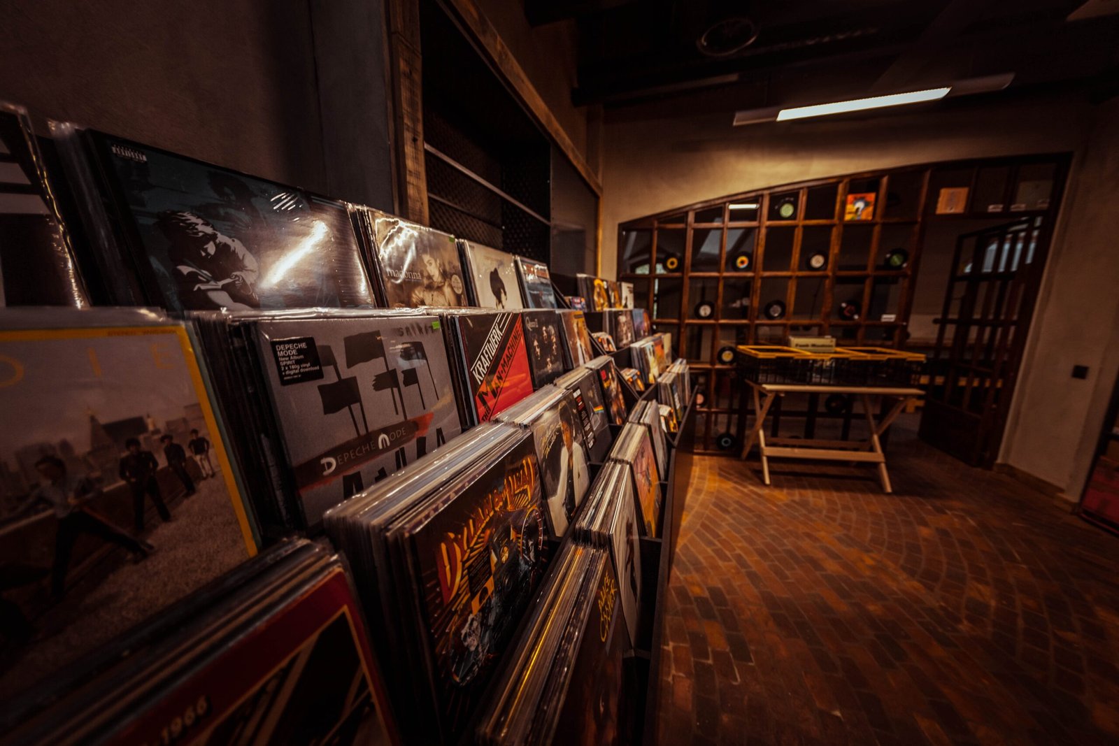 a room with shelves and posters